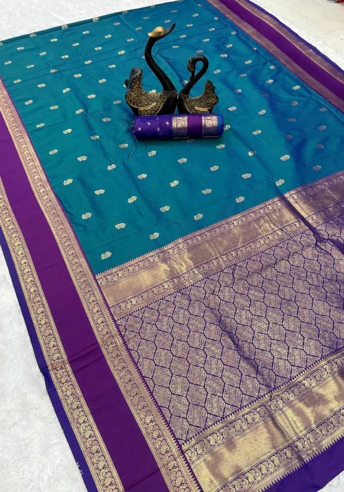 Symmetrical Rama Soft Banarasi Silk Saree With Captivating Blouse Piece