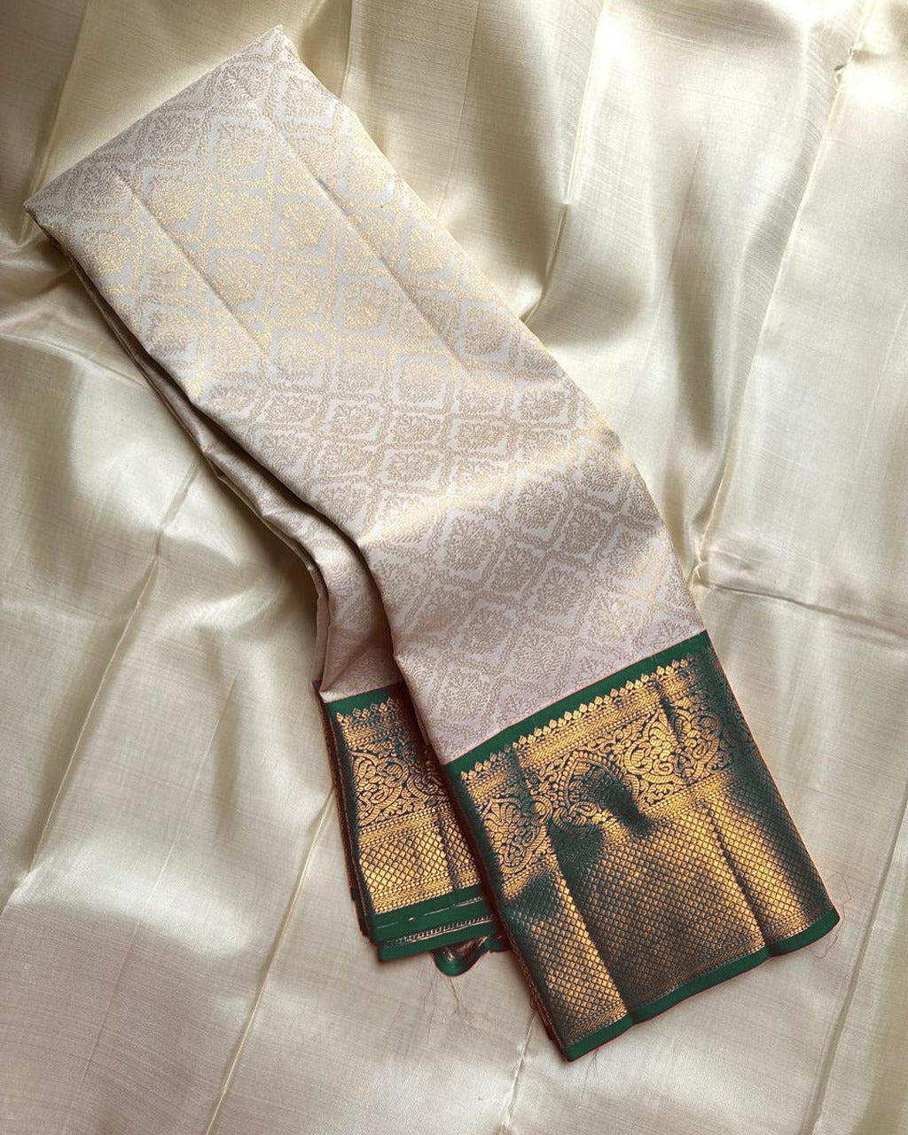 Varnika – Ivory Kanjivaram Silk Saree with Emerald Zari Border